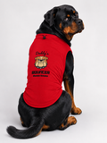 A Rottweiler dog wearing a red sleeveless dog shirt with a bulldog graphic and the text 'Daddy's Bouncer Mountain Dog Team', photographed against a light gray studio background.